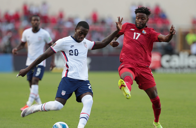  Soccer Football - World Cup - CONCACAF Qualifiers - Panama v United States - Estadio Rommel Fernandez, Panama City, Panama - October 10, 2021 Timothy Weah of the US in action with Panama's Freddy Gondola  (credit: ERICK MARCISCANO/REUTERS)