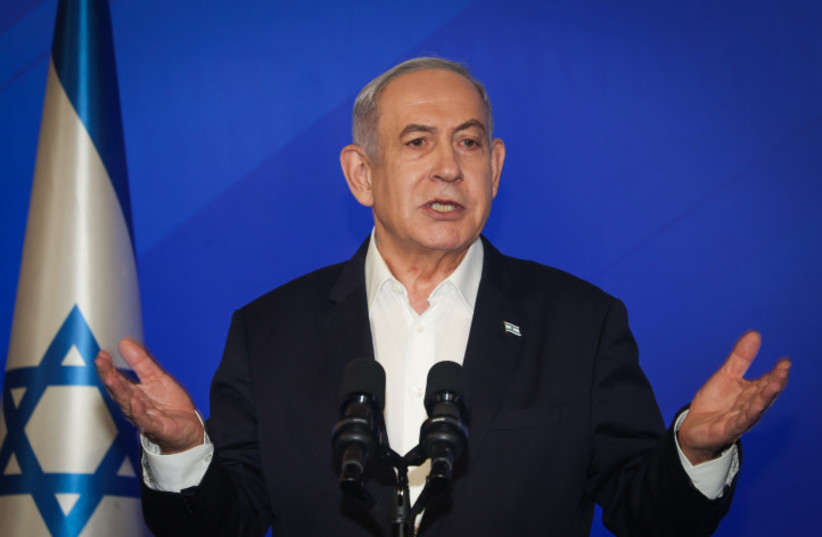  Israeli prime minister Benjamin Netanyahu speaks during a press conference at the Ministry of Defense, in Tel Aviv on January 18, 2024 (credit: YARIV KATZ/POOL)