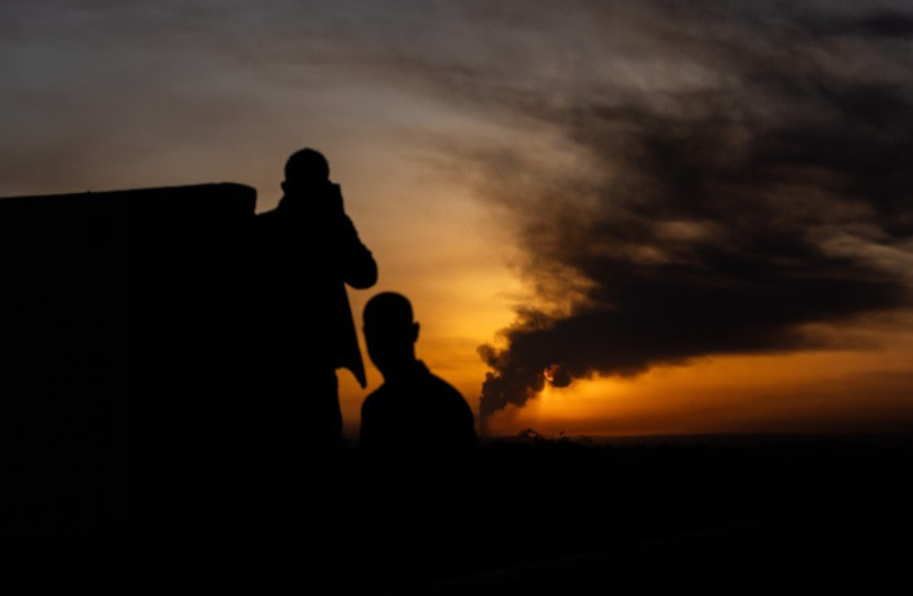  Smoke rises after Israeli airstrike and during the sunset in the Gaza, January 21, 2024 (credit: Chaim Goldberg/Flash90)