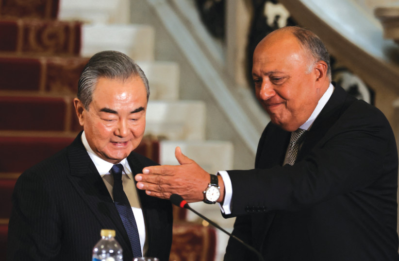  EGYPTIAN FOREIGN MINISTER Sameh Shoukry and Chinese Foreign Minister Wang Yi hold a news conference in Cairo last week. The Chinese foreign minister was mobilized to express his condemnation of the prospects of thousands of Palestinians pouring into Sinai, the writer notes. (credit: MOHAMED ABD EL GHANY/REUTERS)