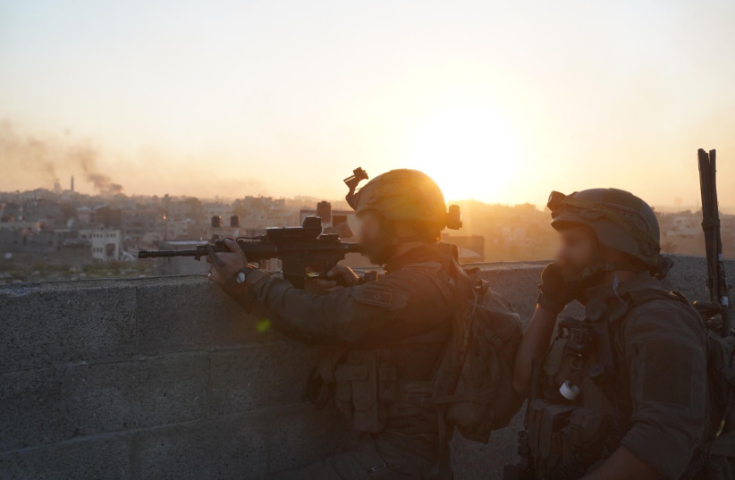   IDF troops operate in the Gaza Strip, January 22, 2024 (credit: IDF SPOKESPERSON'S UNIT)