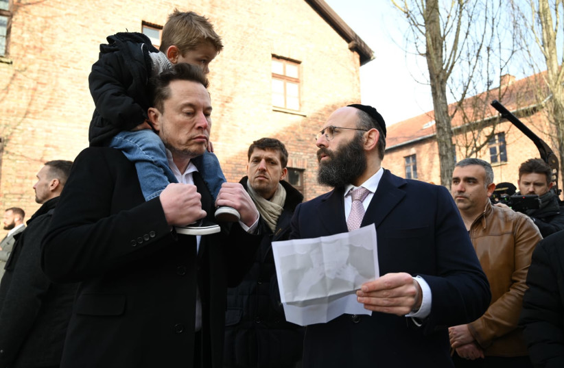  Businessman Elon Musk, left, visits the site of the Auschwitz-Birkenau death and concentration camp, January 22, 2024. (credit: YOAV DODKOVITZ)