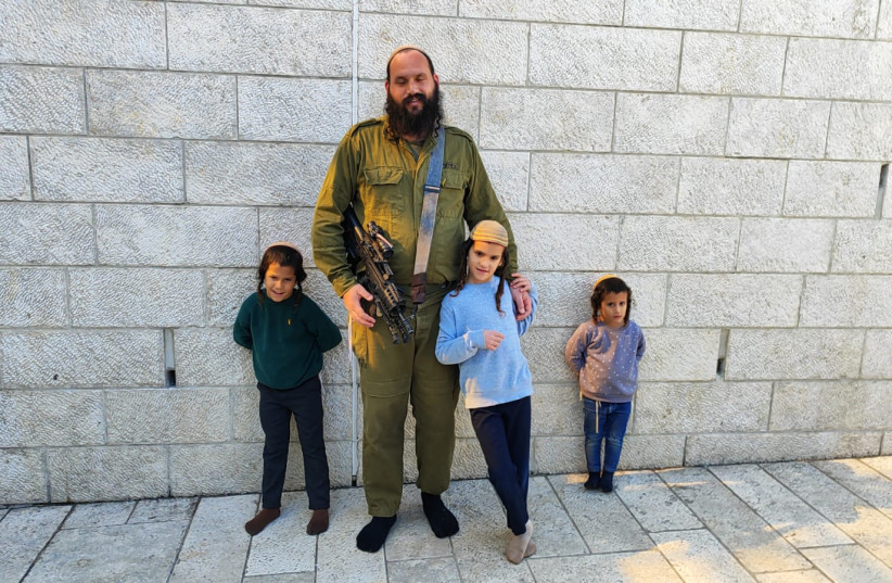  Rabbi Avraham Yitzchak Peirman and his three sons. (credit: Beyadenu)