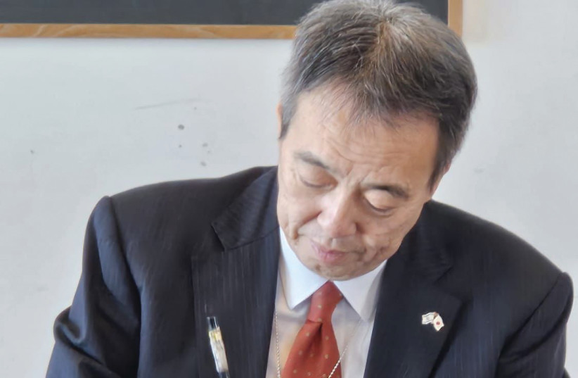 JAPANESE AMBASSADOR Koichi Mizushima writes at the ‘Kakizome’ ceremony.  (credit: EYAL HIRSCH)