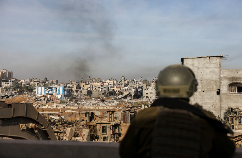  An Israeli soldier operates, amid the ongoing conflict between Israel and the Palestinian Islamist group Hamas, in Gaza, January 8, 2024.  (credit: REUTERS/Ronen Zvulun)