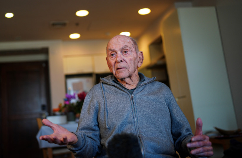  Haim Raanan, 88, a Holocaust survivor who also survived the deadly October 7 Hamas attack on Kibbutz Beeri, speaks during an interview with Reuters at his temporary accommodation in Tel Aviv, Israel January 21, 2024. (credit: REUTERS/ALEXANDRE MENEGHINI)