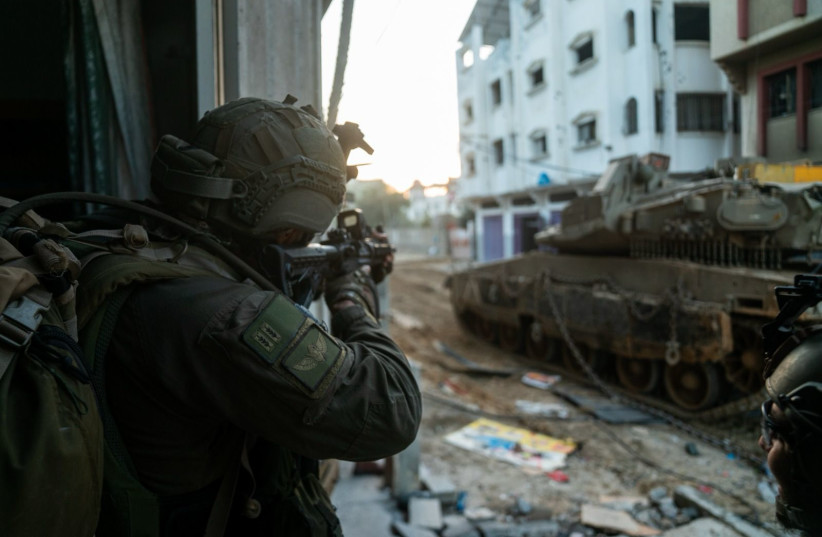  IDF Commando Brigade troops operate in Khan Yunis, Gaza. January 27, 2024. (credit: IDF SPOKESPERSON'S UNIT)