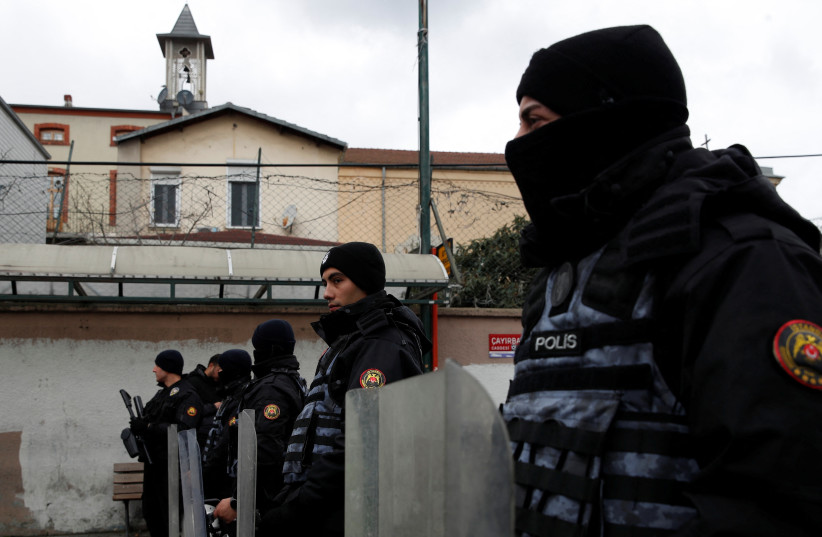  Turkish police stand guard outside the Italian Santa Maria Catholic Church after two masked gunmen were shooting during Sunday service, in Istanbul, Turkey January 28, 2024. (credit: DILARA SENKAYA/REUTERS)