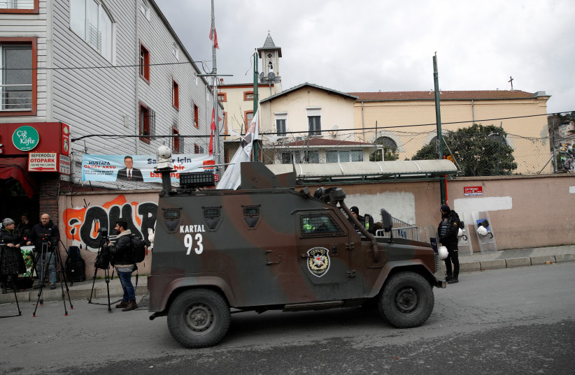  A Turkish police armoured vehicle drives outside the Italian Santa Maria Catholic Church after two masked gunmen were shooting during Sunday service, in Istanbul, Turkey January 28, 2024.  (credit: DILARA SENKAYA/REUTERS)