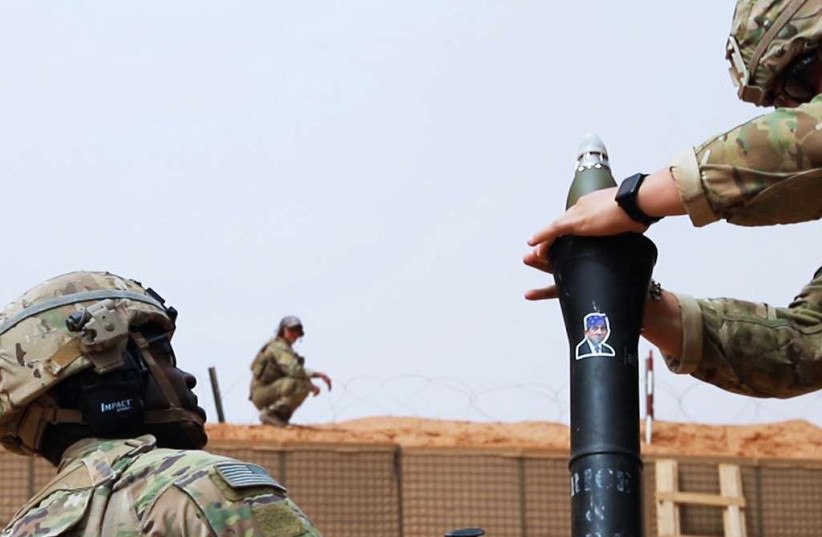  A Soldier deployed to At-Tanf Garrison, Syria, hangs an 81 mm mortar round before firing at a distant target during a readiness exercise on April 22, 2020. Coalition forces and our partner the Maghaweir al-Thowra remain united and determined in our mission to degrade and defeat Daesh in southern Sy (credit: STAFF SGT. WILLIAM HOWARD SPECIAL OPERATIONS JOINT TASK FORCE-OPERATION INHERENT RESOLVE)