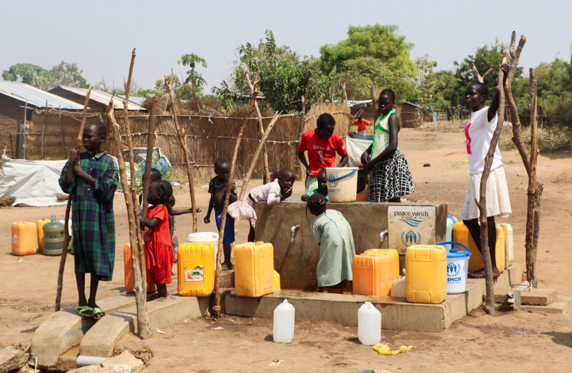  Sudanese refugees collect water from a borehole at the Gorom Refugee camp hosting Sudanese refugees who fled recent fighting, near Juba, in South Sudan January 26, 2024. (credit: REUTERS/Samir Bol)