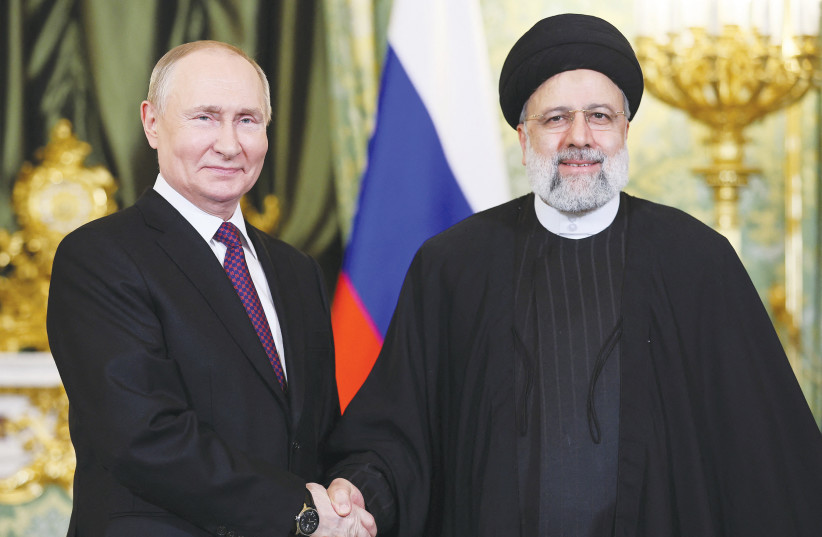 The Russian and Iranian Presidents meet in Moscow last month. Increasingly, Tehran is acting not just as an ally but as a proxy for Russia in the Middle East, much as it has its own regional proxies, the writers maintain. (credit: SPUTNIK/REUTERS)