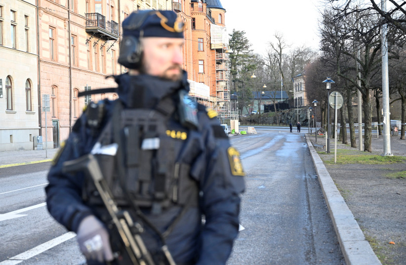  Emergency workers stand near the Israeli embassy in Stockholm, January 31, 2024 (credit:  HENRIK MONTGOMERY/TT NEWS AGENCY/VIA REUTERS)