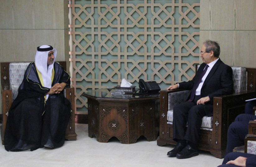 Syrian Foreign Minister Faisal Mekdad meets with new ambassador of the United Arab Emirates to Syria, Hassan al-Shehi, in Damascus, Syria January 30, 2024. (credit: REUTERS/FIRAS MAKDESI)