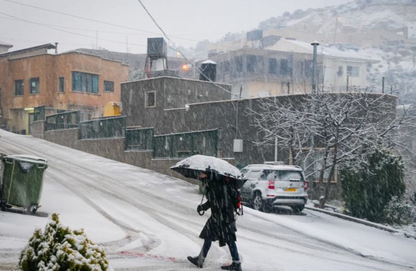  Snow falls in Majdal Shams, in the Golan Heights, Northern Israel on January 30, 2024 (credit: MICHAEL GILADI/FLASH90)