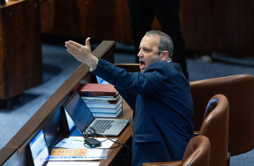  MK Gilad Kariv reacts during a plenum session at the assembly hall of the Knesset, the Israeli parliament in Jerusalem, on December 3, 2023 (credit: YONATAN SINDEL/FLASH90)