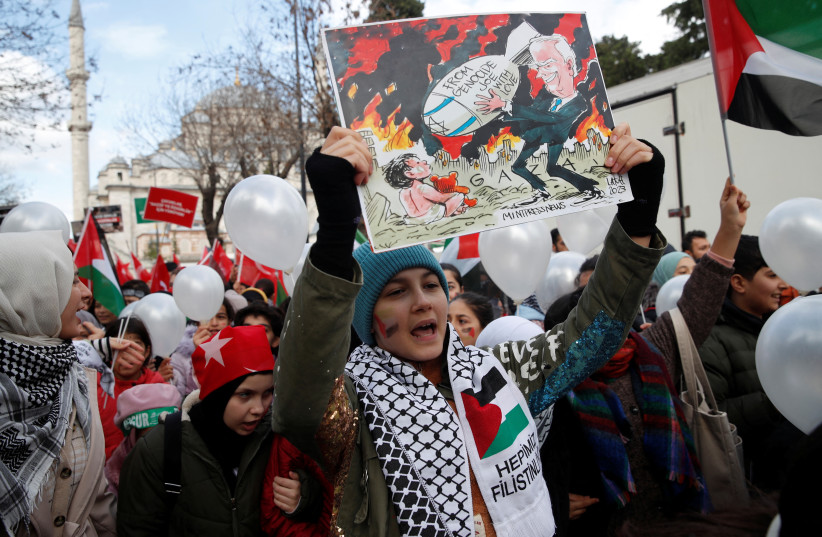  People take part in a demonstration in solidarity with Palestinian children in Gaza Strip, December 23, 2023 (credit: REUTERS/DILARA SENKAYA)