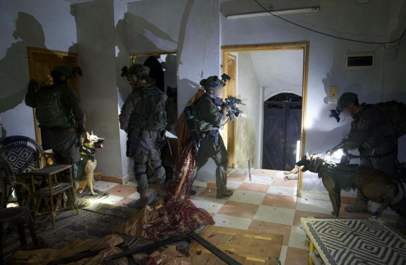  IDF soldiers raid a building in the Gaza Strip, February 3rd, 2024 (credit: IDF SPOKESPERSON'S UNIT)