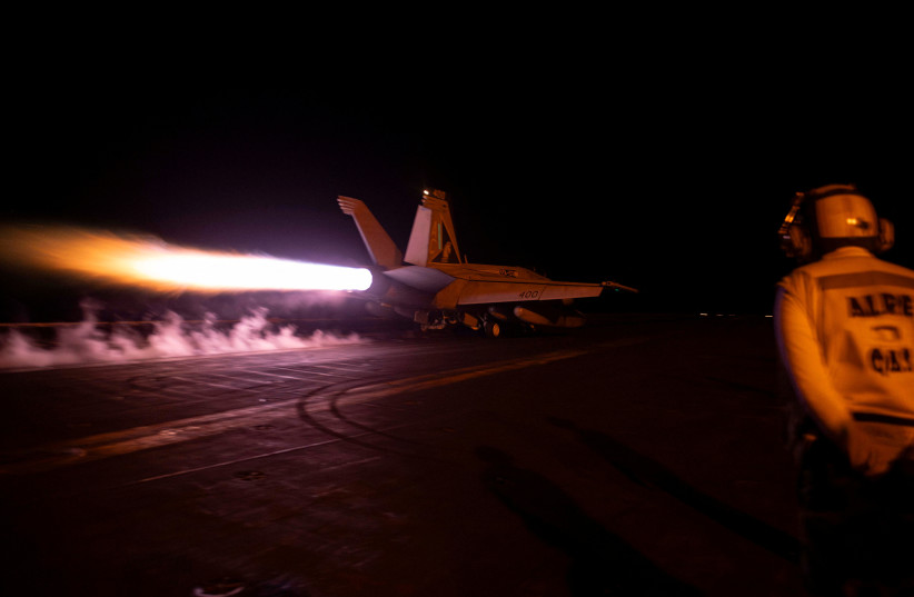  A fighter jet is launched from the U.S. Navy aircraft carrier USS Dwight D. Eisenhower during a strike against what the U.S. military describe as Houthi military targets in Yemen, February 3, 2024 (credit: US NAVY/HANDOUT VIA REUTERS)