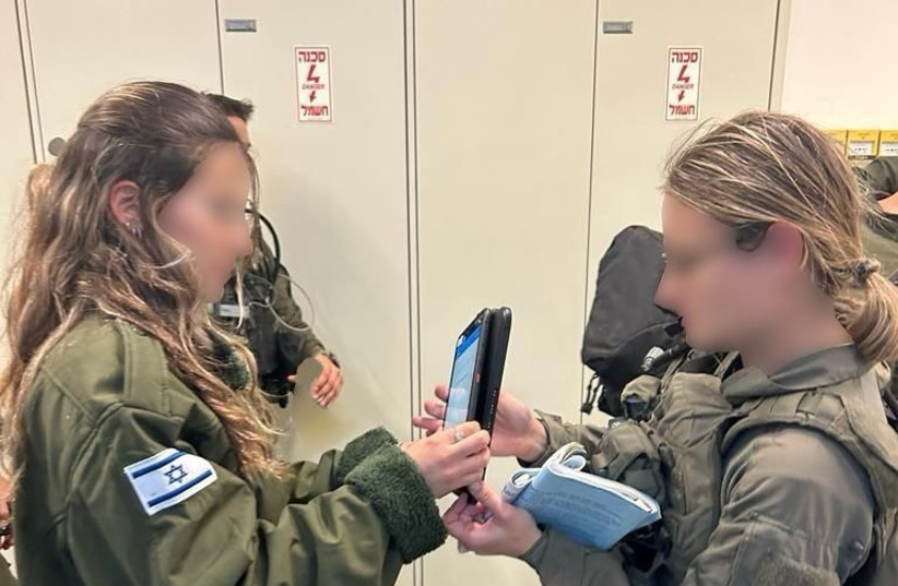  Two IDF recruits use the new medical app unveiled by the military, February 4, 2024 (credit: IDF SPOKESPERSON'S UNIT)