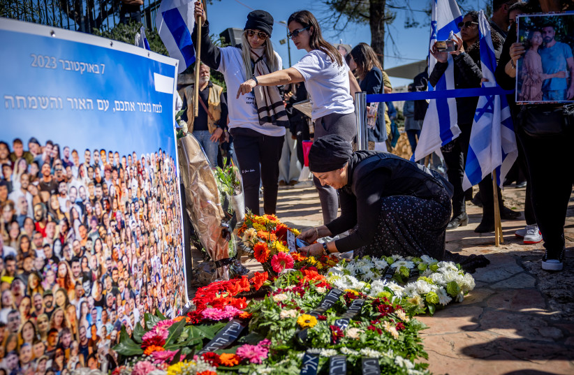  Families of Israelis who were murdered by Hamas terrorists at the Nova festival place pictures of their loved ones outside the Israeli parliament in Jerusalem on February 7, 2024.  (credit: YONATAN SINDEL/FLASH90)