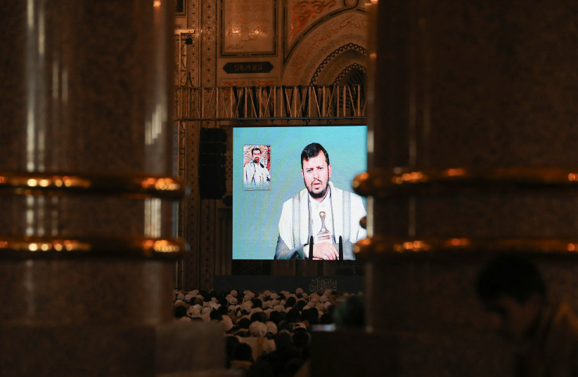  Houthi leader Abdul-Malik al-Houthi addresses followers via a video link at the al-Shaab Mosque, formerly al-Saleh Mosque, in Sanaa, Yemen February 6, 2024. (credit: REUTERS/KHALED ABDULLAH)