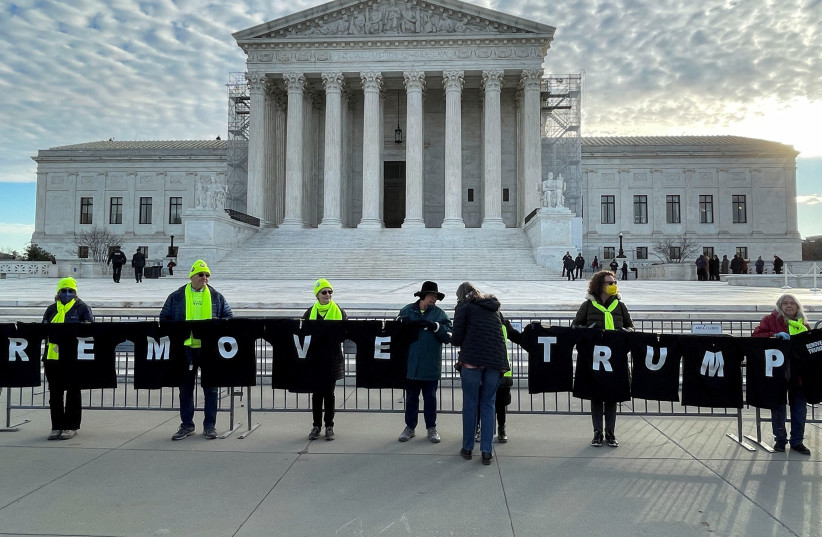  Demonstrators gather outside the U.S. Supreme Court ahead of arguments in former U.S. President Donald Trump's appeal of a lower court's ruling disqualifying him from the Colorado presidential primary ballot, in Washington, U.S., February 8, 2024. (credit: REUTERS/Andrew Chung)