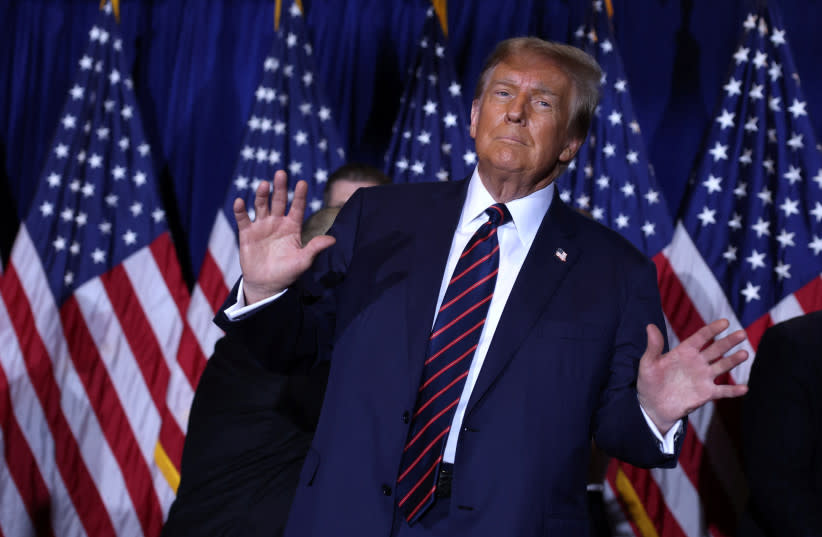 Former US President Donald Trump gestures in Nashua, New Hampshire, January 23, 2024