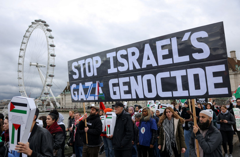  Demonstrators cross the Westminster Bridge as they participate in a silent procession during a vigil for Gaza, amid the ongoing conflict between Israel and the Palestinian Islamist group Hamas, in London, Britain February 10, 2024.  (credit: REUTERS/HOLLIE ADAMS)