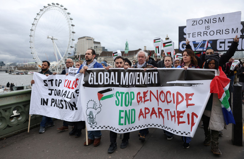  Demonstrators cross the Westminster Bridge as they participate in a silent procession during a vigil for Gaza, amid the ongoing conflict between Israel and the Palestinian Islamist group Hamas, in London, Britain February 10, 2024. (credit: REUTERS/HOLLIE ADAMS)