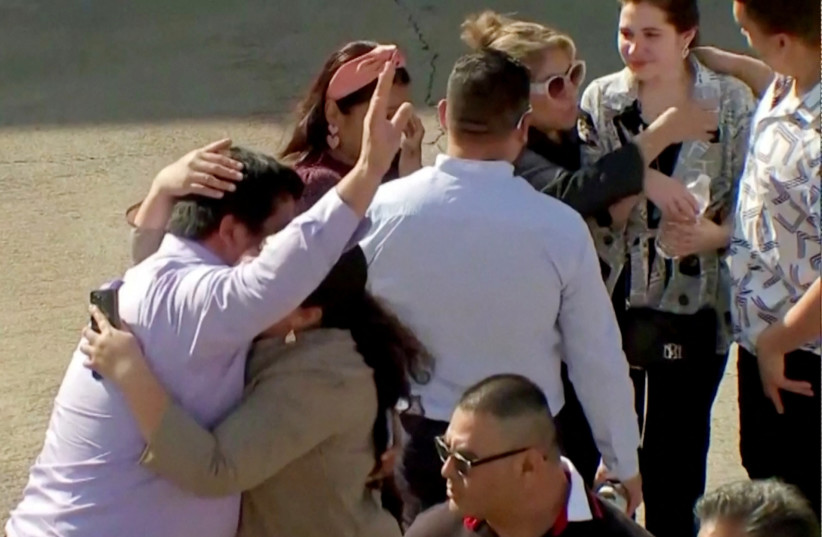  Evacuated parishoners react outside television evangelist Joel Osteen's Lakewood Church after a shooting incident in Houston, Texas, U.S. February 11, 2024 in a still image from video (credit: Courtesy ABC affiliate KTRK via REUTERS.)
