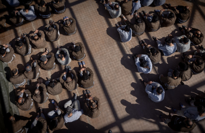  Hamas terrorists who were caught during the October 7 massacre and during the IDF operation in the Gaza Strip, seen at a courtyard in a prison in southern Israel, February 14, 2024 (credit: Chaim Goldberg/Flash90)