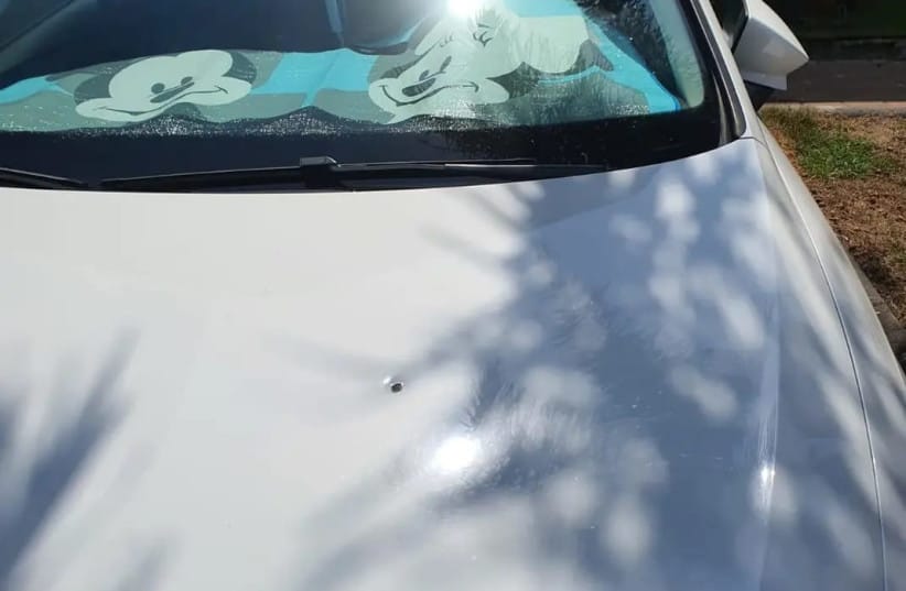 A bullet hole in the hood of a car in Bat Hefer.