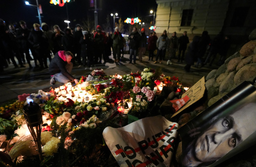 People attend a memorial event, following the death of Russian opposition leader Alexei Navalny, in Vilnius, Lithuania February 16, 2024. (credit: REUTERS/JANIS LAIZANS)