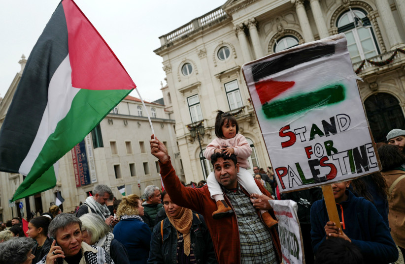  People take part in a demonstration in solidarity with Palestinians in Gaza, amid the ongoing conflict between Israel and the Palestinian group Hamas, in Lisbon, Portugal, November 16, 2023 (credit: PEDRO NUNES/REUTERS)