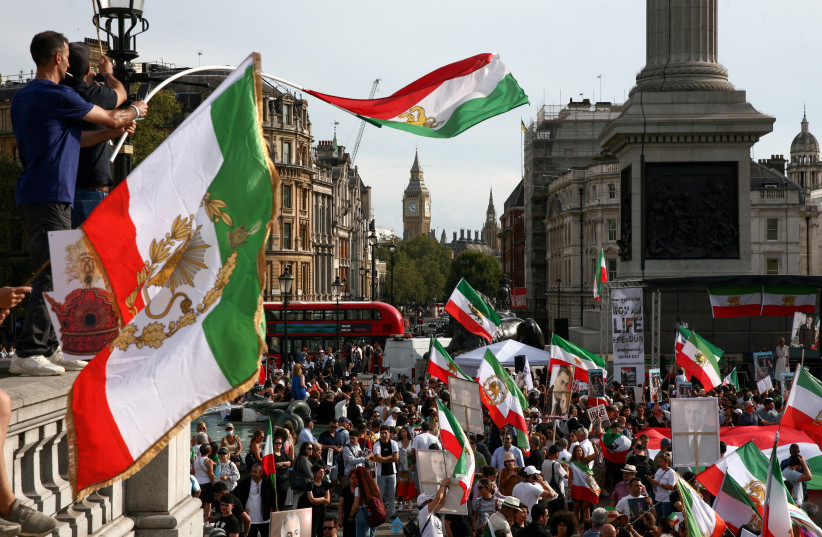  People protest in Trafalgar Square on the first anniversary of the death in custody of Mahsa Amini, a 22-year-old Kurdish woman arrested by the morality police in 2022 for allegedly flouting mandatory dress codes, in London, Britain, September 16, 2023. (credit: REUTERS/KEVIN COOMBS)