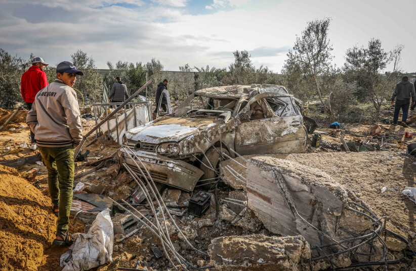 Palestinians inspect the damage from an Israeli airstrike in Rafah, southern Gaza Strip, on February 18, 2024 (credit: ABED RAHIM KHATIB/FLASH90)