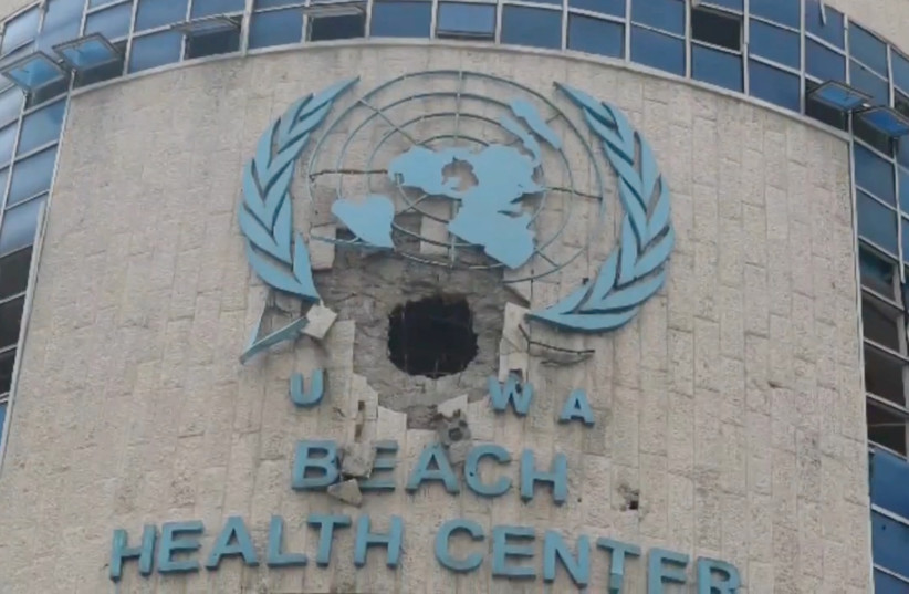  A view of the damaged exterior of a UNRWA health centre, amid the ongoing conflict between Israel and the Palestinian Islamist group Hamas, in Gaza, in this still image taken from video released February 15, 2024.  (credit: Handout via Reuters)