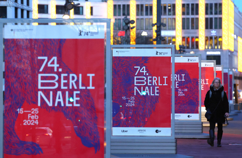  A pedestrian walks past advertising billboards for the upcoming 74th Berlinale International Film Festival in Berlin, Germany, February 13, 2024.  (credit: Fabrizio Bensch/Reuters)