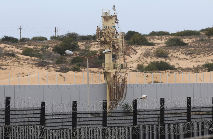 A border wall stands between Rafah and Egypt, amid fears of an exodus of Palestinians into Egypt, as the conflict between Israel and Hamas continues, in Rafah southern Gaza Strip February 16, 2024 (credit: IBRAHEEM ABU MUSTAFA/REUTERS)