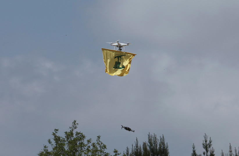  A drone carries a Hezbollah flag, May 21, 2023 (credit: REUTERS/AZIZ TAHER)