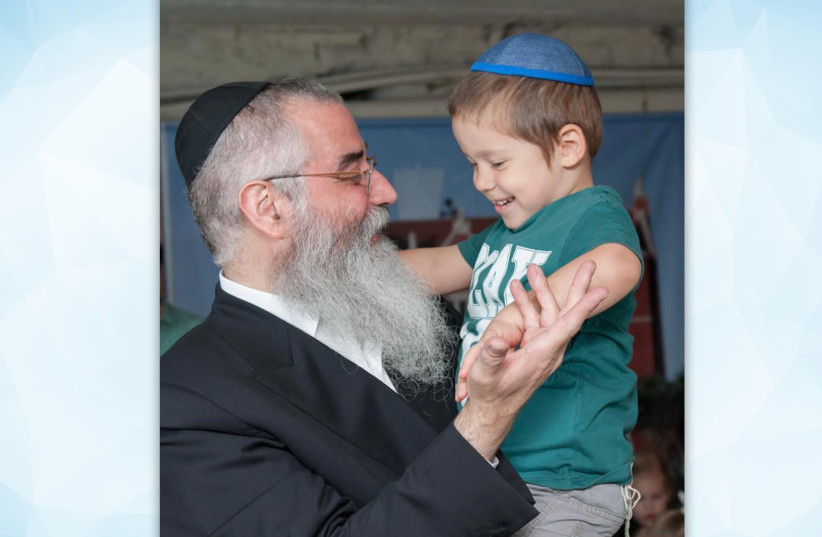 Rabbi Avraham Wolff, founder of the Mishpacha Children's Home, aims to nurture the children under his care so they can rise above their difficult circumstances and have a chance at normal, happy lives. (credit: Courtesy of Mishpacha Chabad Odessa)
