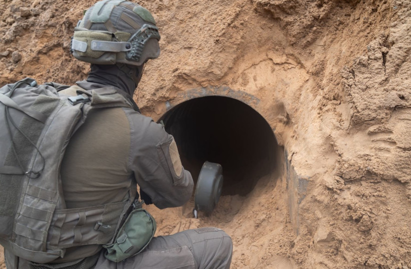 Yahalom soldier prepares a Hamas tunnel for demolition in Gaza (credit: IDF SPOKESPERSON'S UNIT)