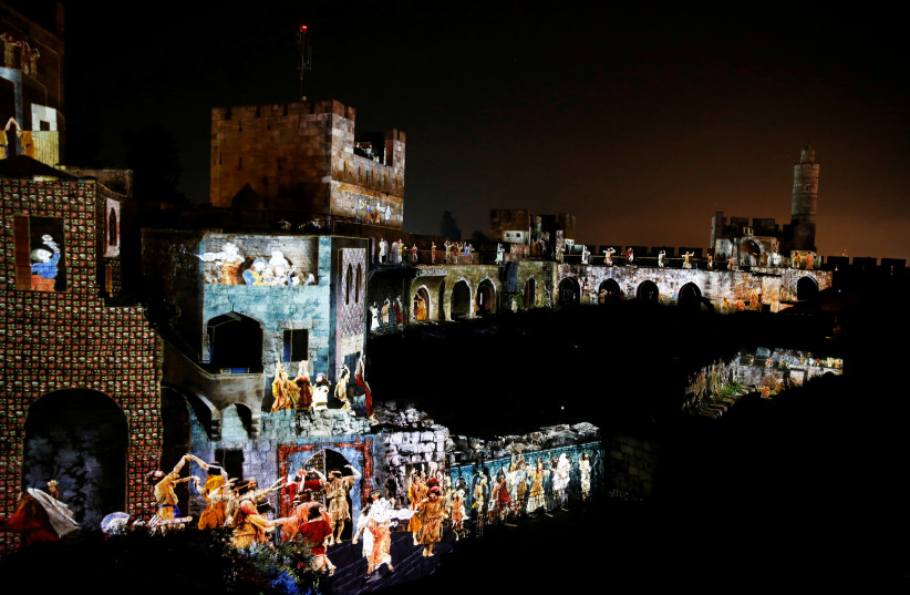  The citadel walls of the Tower of David Museum are illuminated during the ''King David'' light and sound show, in Jerusalem's Old City, March 11, 2018. (credit: AMMAR AWAD/REUTERS)
