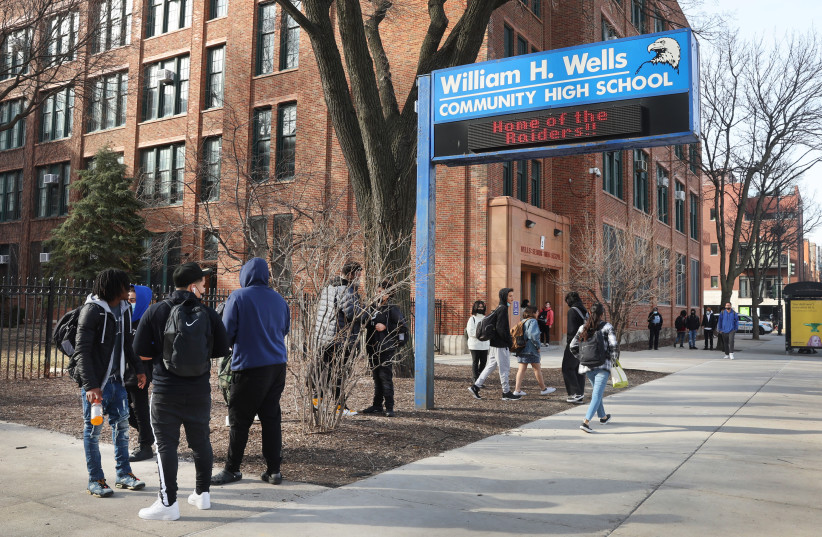  Students leave William Wells High School, part of Chicago Public Schools, March 14, 2022, in Chicago Illinois. CPS is the subject of a new federal Title VI discrimination investigation with the Department of Education. (credit: SCOTT OLSON/GETTY IMAGES/JTA)