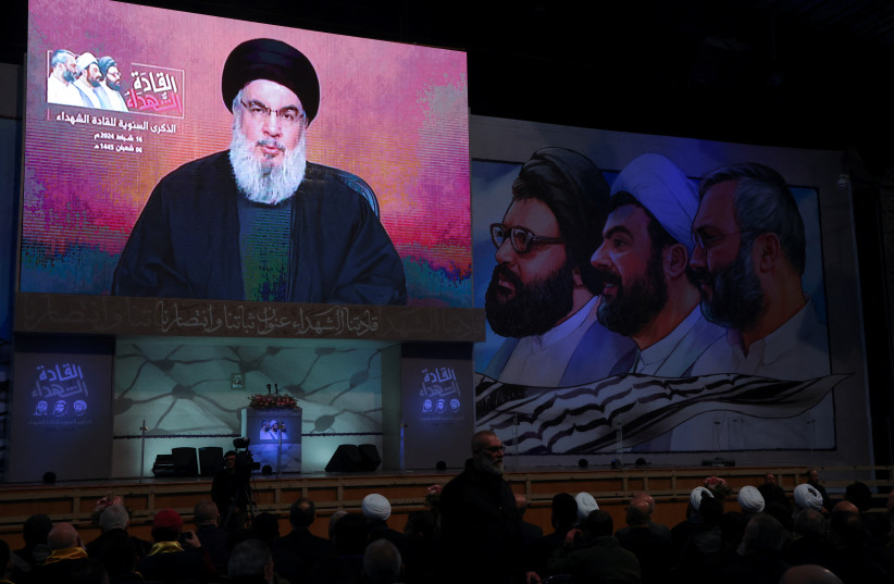  Lebanon's Hezbollah leader Sayyed Hassan Nasrallah appears on a screen as he gives a televised address during a rally commemorating the group's late leaders in Beirut's southern suburbs, Lebanon February 16, 2024. (credit: REUTERS/MOHAMED AZAKIR)
