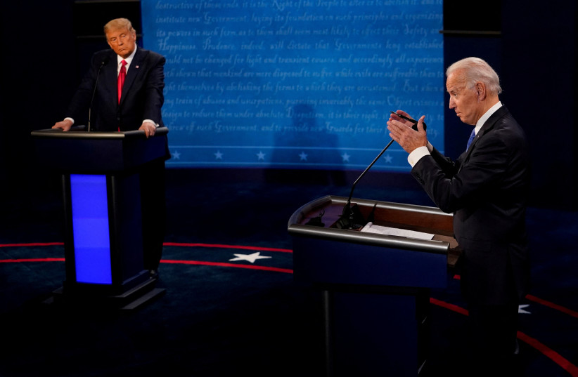  Democratic presidential candidate former Vice President Joe Biden answers a question as President Donald Trump listens during the second and final presidential debate at the Curb Event Center at Belmont University in Nashville, Tennessee, U.S., October 22, 2020. (credit: Morry Gash/Reuters)