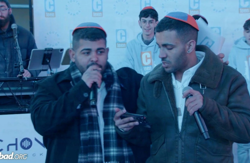  Survivors of the Hamas massacre at the Nova music festival on October 7 address a crowd of Jewish teenagers in New York's Times Square, Feb 24, 2024. (credit: screenshot)