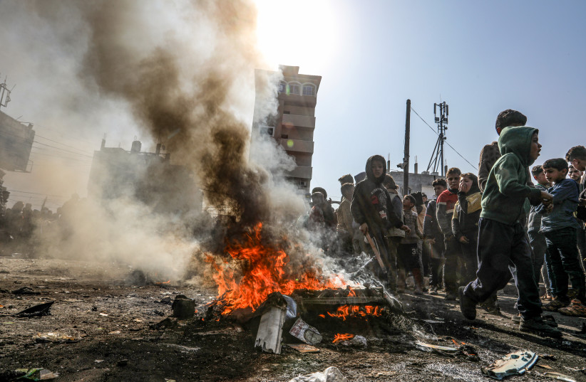  Palestinians burn tires during a protest against Hamas in Rafah, in the southern Gaza Strip, on February 28, 2024 (credit: ABED RAHIM KHATIB/FLASH90)