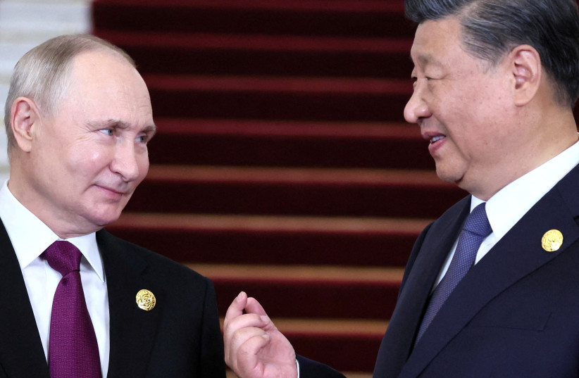  Russian President Vladimir Putin speaks with Chinese President Xi Jinping during a welcoming ceremony at the Belt and Road Forum in Beijing, China, October 17, 2023.  (credit: Sputnik/Sergei Savostyanov/Pool via REUTERS)